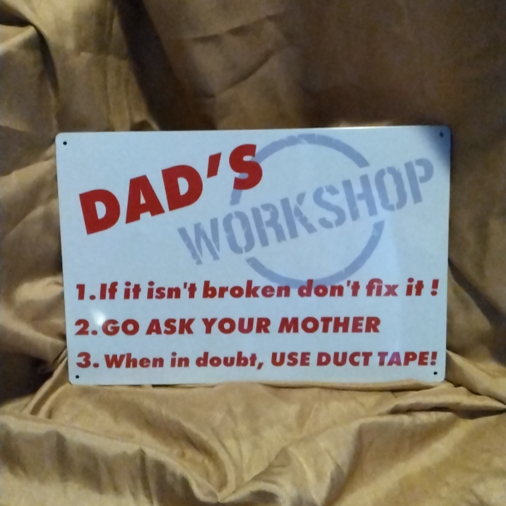 A small male dad's workshop joke sign